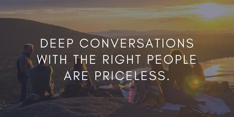 Image of people on a beach as the sun goes down with the words ‘deep conversations with the right people are priceless’